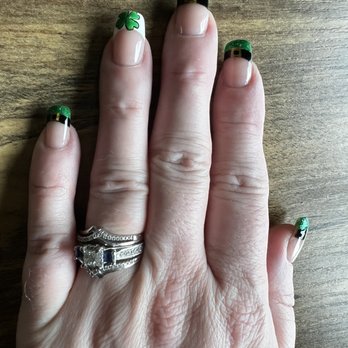 Sassy Nail & Spa - a woman's hand with green nail polish - Nail Salons Near Me - Portage, Indiana