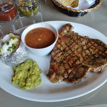 Restaurant Angus Beef - Porterhouse, thin and tough. Guacamole, Baked Potato and frijoles from the pot. - Steakhouses Near Me - Rosarito, BCN Restaurant Angus Beef - Porterhouse, thin and tough. Guacamole, Baked Potato and frijoles from the pot. - Steakhouses Near Me - Rosarito, BCN