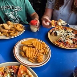 Geno's Pizza and Burgers - Side of waffle fries, chicken strips with side of onion rings, custom pizza with pepperoni, sausage, and olives