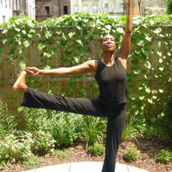 Harlem Wellness Center - Founder, yoga instructor and coach, Vivian shows advanced poses.