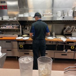 a man working in a restaurant kitchen a man working in a restaurant kitchen