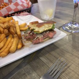 Under cooked burger with the wrong cheese Under cooked burger with the wrong cheese