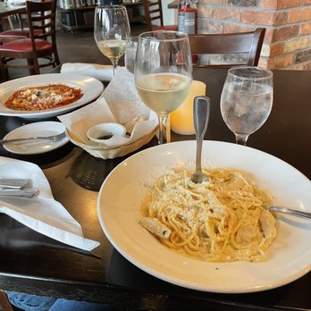 Armando's - Spaghetti Alfredo and the cheese ravioli. Rinaldi Moscato d'Asti is a delicious sweet wine. - Italian Near Me - Orlando, Florida