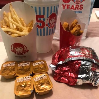 Wendy's - a table with fries, a drink, and a bag of chicken nuggies - Fast Food Near Me - Port Jefferson Station, New York Wendy's - a table with fries, a drink, and a bag of chicken nuggies - Fast Food Near Me - Port Jefferson Station, New York
