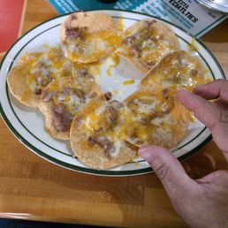 7 nachos on a 13.00 order the size of 50 cent pieces.