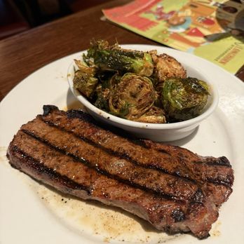 LongHorn Steakhouse - New York strip with side of brussel sprouts - Steakhouses Near Me - Troy, Michigan LongHorn Steakhouse - New York strip with side of brussel sprouts - Steakhouses Near Me - Troy, Michigan