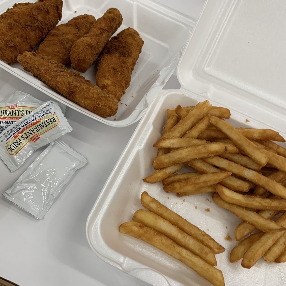 a tray of fried chicken and french fries a tray of fried chicken and french fries