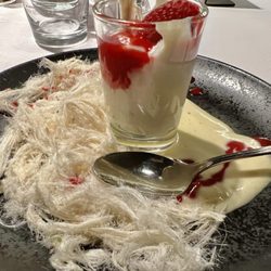 11A - Panna cotta type dessert with vanilla and raspberry sauces, cotton candy floss.