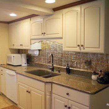 Ritter Homes - a kitchen with white cabinets and granite countertops - General Contractors Near Me - Stephens City, Virginia Ritter Homes - a kitchen with white cabinets and granite countertops - General Contractors Near Me - Stephens City, Virginia