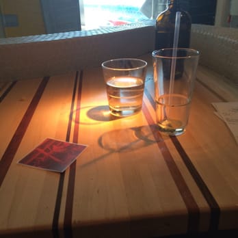 Root Down DIA - Table with my lovely 5th glass of tea plus fresh water in a brown bottle. - New American Near Me - Denver, Colorado Root Down DIA - Table with my lovely 5th glass of tea plus fresh water in a brown bottle. - New American Near Me - Denver, Colorado