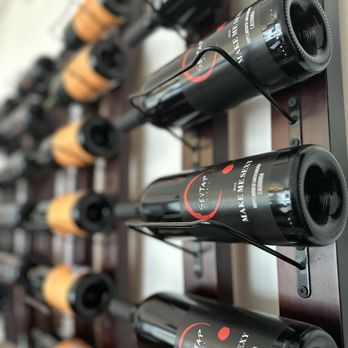 Sevtap Winery - a wall of wine bottles - Wine Tasting Room Near Me - Solvang, California