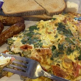 This is their veggie omelette. Dead on arrival. Completely bruised. More of a frittata than a fluffy omelette. Pretty bad. This is their veggie omelette. Dead on arrival. Completely bruised. More of a frittata than a fluffy omelette. Pretty bad.