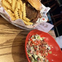 Cajun burger with BLT salad. Cajun burger with BLT salad.
