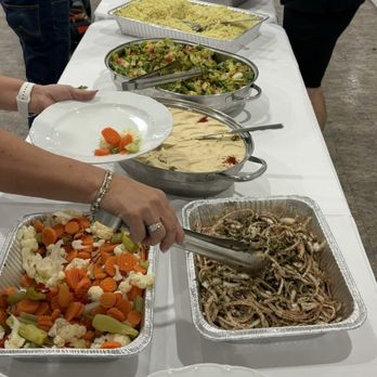 Raffi's Catering and Banquet - Trays of veggies, seasoned grilled onions, humus, cold salad with lettuce cucumbers tomatoes and rice - Middle Eastern Near Me - Pasadena, California Raffi's Catering and Banquet - Trays of veggies, seasoned grilled onions, humus, cold salad with lettuce cucumbers tomatoes and rice - Middle Eastern Near Me - Pasadena, California