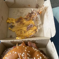 McDonald's - Found the patty paper in my Bacon Quarter Pounder. If you can't train someone to make a burger dont train anyone at all