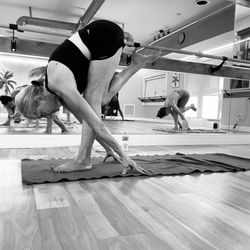 Yoga Shala & Wellness Center - Doreen in Fallen Flamingo Pose