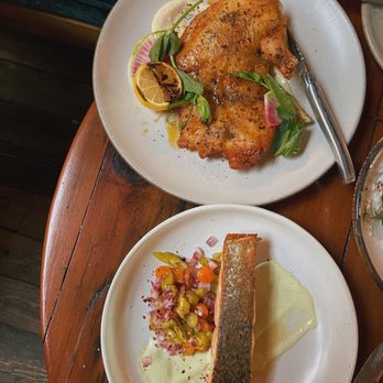 Manuela - Heritage Green Circle Half Chicken& Pan Roasted Wild King Salmon - New American Near Me - Los Angeles, California Manuela - Heritage Green Circle Half Chicken& Pan Roasted Wild King Salmon - New American Near Me - Los Angeles, California