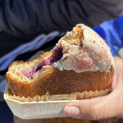 Epi Fanny - New York Roll Croissant filled with a raspberry pastry cream and topped with a white chocolate ganache.