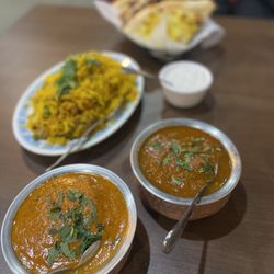 Chaat of India - Butter chicken, chicken curry, rice and naan.
