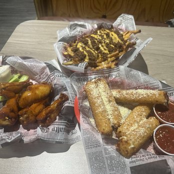 The Dirty Armadillo - From the top: chili fries, homemade mozzarella sticks, bourbon wings - Sports Bars Near Me - Little River, South Carolina The Dirty Armadillo - From the top: chili fries, homemade mozzarella sticks, bourbon wings - Sports Bars Near Me - Little River, South Carolina