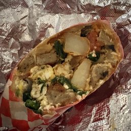 Veggie breakfast burrito -added sausage. Veggie breakfast burrito -added sausage.