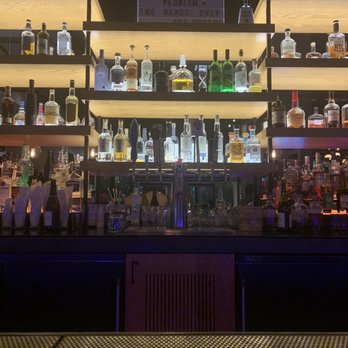 Moxy Chicago Downtown - One side of the bar - Hotels Near Me - Chicago, Illinois Moxy Chicago Downtown - One side of the bar - Hotels Near Me - Chicago, Illinois