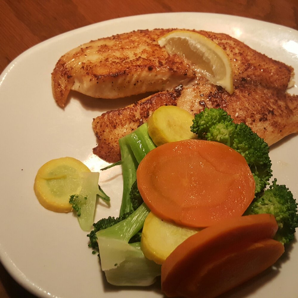 Outback Steakhouse - Grilled tilapia and seasoned mixed veggies. My husband said the flavor was mouth watering - Steakhouses Near Me - Middletown, New York Outback Steakhouse - Grilled tilapia and seasoned mixed veggies. My husband said the flavor was mouth watering - Steakhouses Near Me - Middletown, New York
