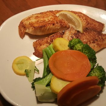 Outback Steakhouse - Grilled tilapia and seasoned mixed veggies. My husband said the flavor was mouth watering - Steakhouses Near Me - Middletown, New York Outback Steakhouse - Grilled tilapia and seasoned mixed veggies. My husband said the flavor was mouth watering - Steakhouses Near Me - Middletown, New York