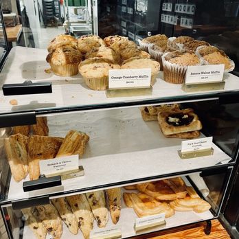 Daily Dose - Baked goods shelf display featuring all current daily items. - Coffee & Tea Near Me - Atlanta, Georgia