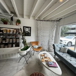 a living room with a couch and a coffee table a living room with a couch and a coffee table
