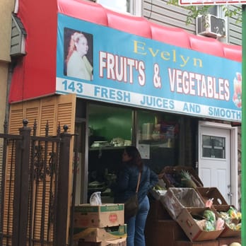 Evelyn Fruits and Vegetables - a woman standing in front of a store - Empanadas Near Me - Brooklyn, New York Evelyn Fruits and Vegetables - a woman standing in front of a store - Empanadas Near Me - Brooklyn, New York