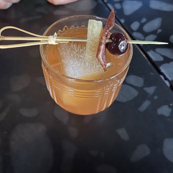 The Coffin Bar - a person holding a cocktail - Beer Bar Near Me - Lancaster, Pennsylvania The Coffin Bar - a person holding a cocktail - Beer Bar Near Me - Lancaster, Pennsylvania