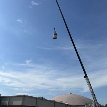 Bluebonnet Heat and Air - New AC unit being lifted to the building roof for expert installation. - Heating & Air Conditioning/HVAC Near Me - Gainesville, Texas Bluebonnet Heat and Air - New AC unit being lifted to the building roof for expert installation. - Heating & Air Conditioning/HVAC Near Me - Gainesville, Texas