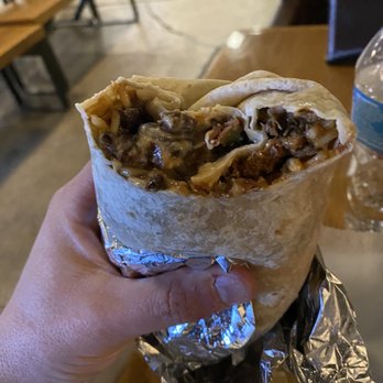 Dank Burrito - a hand holding a burrito - Tacos Near Me - Raleigh, North Carolina Dank Burrito - a hand holding a burrito - Tacos Near Me - Raleigh, North Carolina