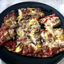 Thin crust, mushrooms, and banana pepper pizza