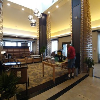 Hilton Garden Inn Toronto/Brampton - Lobby has lots of chairs. Snacks and drinks are also at the entrance. - Hotels Near Me - Brampton, Ontario Hilton Garden Inn Toronto/Brampton - Lobby has lots of chairs. Snacks and drinks are also at the entrance. - Hotels Near Me - Brampton, Ontario