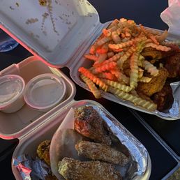 Garlic parmesan chicken, lemon pepper wings, and fries