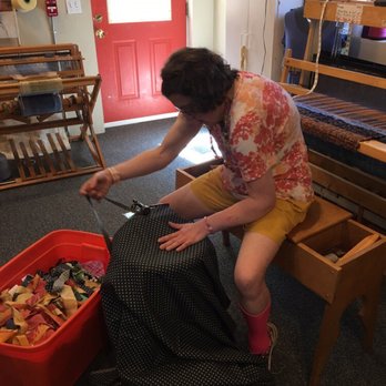 Spindleworks - An artist cutting strips to be used onthe loom to make a rag rug. - Arts & Crafts Near Me - Brunswick, Maine