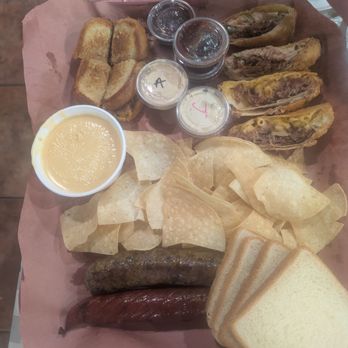 La Cruda Brand BBQ - Smoked boudin link, jalapeno cheddar link, queso w/chips, brisket Mac n cheese and Texas Twinkie egg roll, chopped beef on Texas toast. - Barbeque Near Me - Crosby, Texas