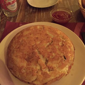 Taberna la Buha la Latina - Tortilla with Caramelized Onions and Mozzarella cheese. - Tapas Bars Near Me - Madrid, M Taberna la Buha la Latina - Tortilla with Caramelized Onions and Mozzarella cheese. - Tapas Bars Near Me - Madrid, M