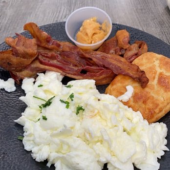 Lido - BUTTERMILK BISCUIT WITH CHIPOTLE-HONEY BUTTER, SCRAMBLED EGGS, BACON - Italian Near Me - New York, New York