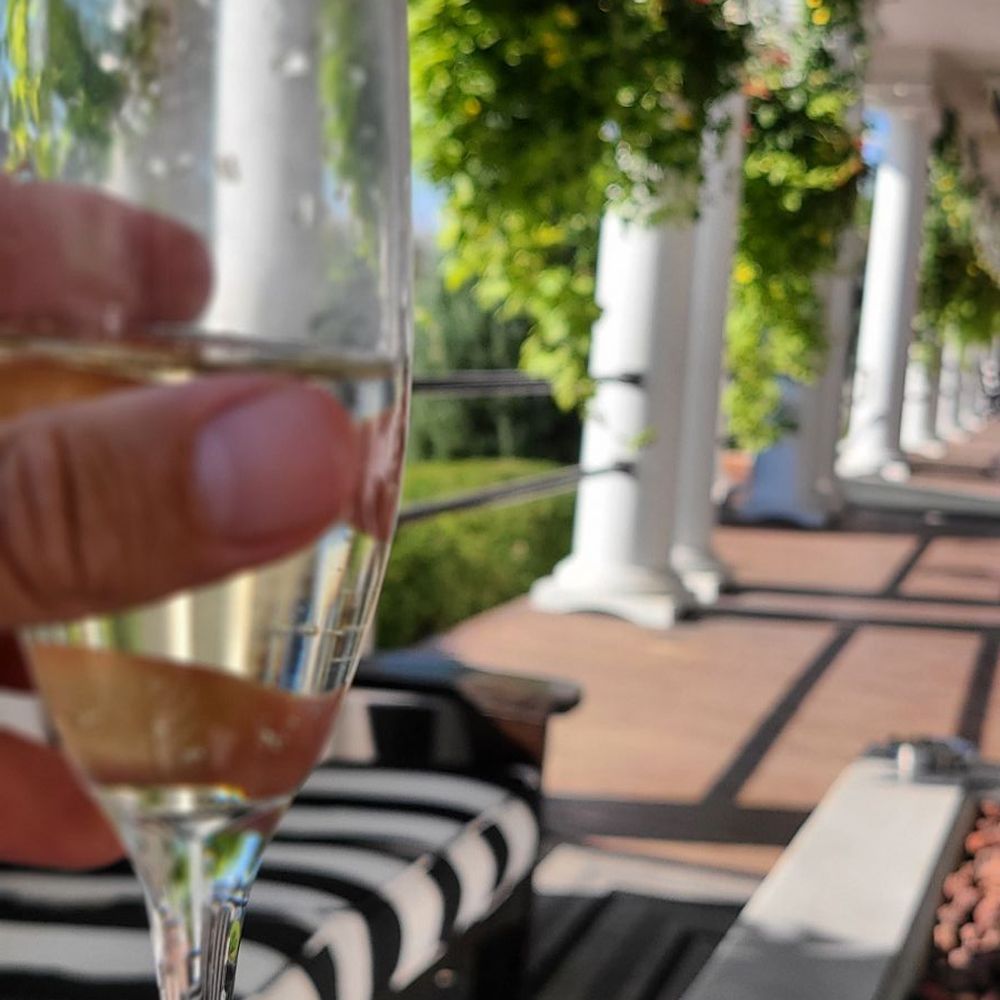 Sacajawea Hotel - Seating area with complimentary glass of wine - Hotels Near Me - Three Forks, Montana