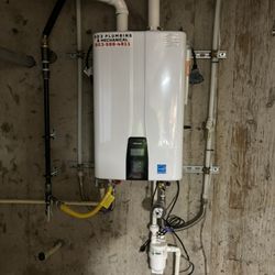 503 Plumbing & Mechanical - Tankless water heater with built in buffer tank and recirculating pump.