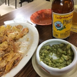 Guadalajar Mexican Grill - Our plate of food and guacamole after we'd devoured most of it. The shrimp, beef and chicken was cooked to perfection.