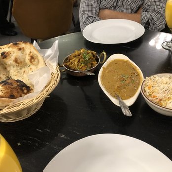 Kabab and Curry's - Garlic naan, cauliflower dish, chicken tikka masala, rice, mango lassi - Indian Near Me - Santa Clara, California Kabab and Curry's - Garlic naan, cauliflower dish, chicken tikka masala, rice, mango lassi - Indian Near Me - Santa Clara, California