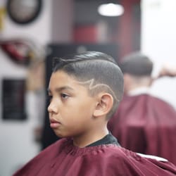 Noe's Barber Shop - Comb over and z part design -by Johnny