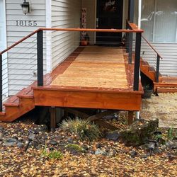 RA Construction - New cedar deck with cabel railing.