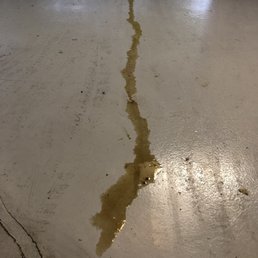 Oil on the floor of my garage from the oil plug left loose