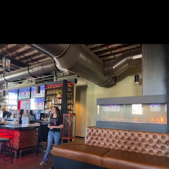 The Railhouse - a woman standing at the bar - Bars Near Me - Columbus, Ohio The Railhouse - a woman standing at the bar - Bars Near Me - Columbus, Ohio