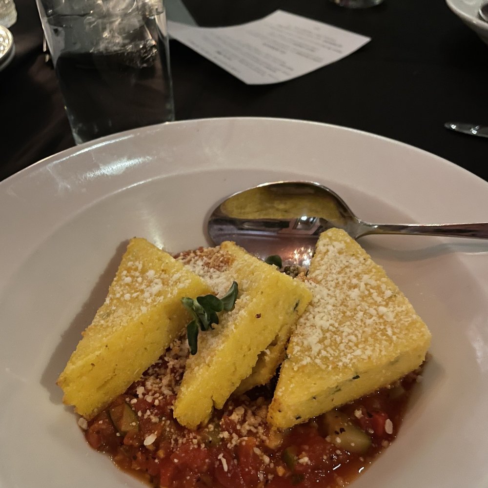 Aposto - Nanee's polenta cakes - tomato and zucchini ragu, Italian parsley, and romano $12 - Mediterranean Near Me - Des Moines, Iowa Aposto - Nanee's polenta cakes - tomato and zucchini ragu, Italian parsley, and romano $12 - Mediterranean Near Me - Des Moines, Iowa